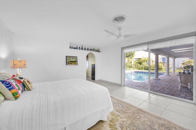 910 Dolphin Dr, Jupiter, FL 33458 - bedroom featuring access to exterior, a ceiling fan, tile patterned flooring, visible vents, and arched walkways