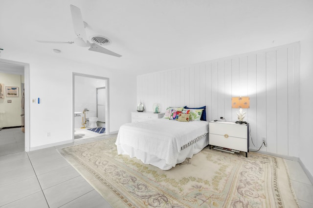 910 Dolphin Dr, Jupiter, FL 33458 - bedroom featuring light tile patterned floors, baseboards, connected bathroom, ceiling fan, and visible vents
