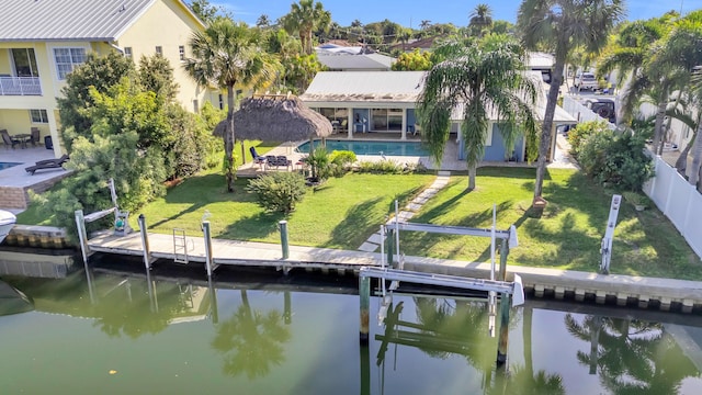910 Dolphin Dr, Jupiter, FL 33458 - exterior space with a water view, boat lift, a patio area, and a yard