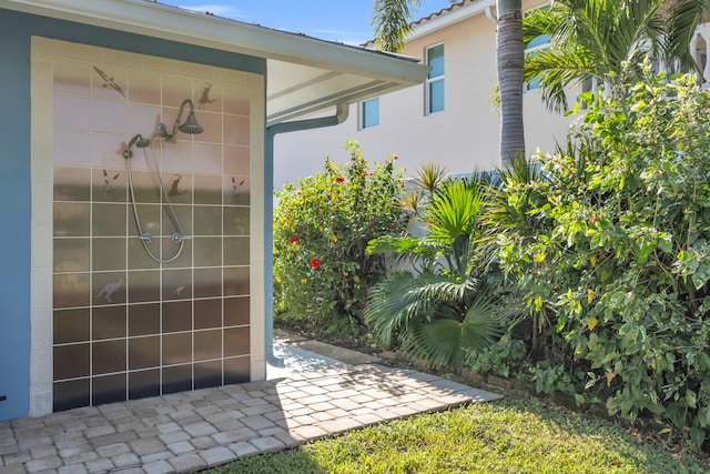 910 Dolphin Dr, Jupiter, FL 33458 - view of exterior entry featuring stucco siding