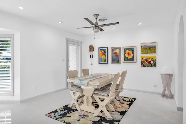 910 Dolphin Dr, Jupiter, FL 33458 - dining room featuring arched walkways, baseboards, recessed lighting, and a ceiling fan