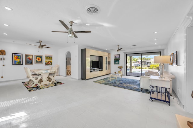 910 Dolphin Dr, Jupiter, FL 33458 - living area featuring arched walkways, visible vents, recessed lighting, and a ceiling fan