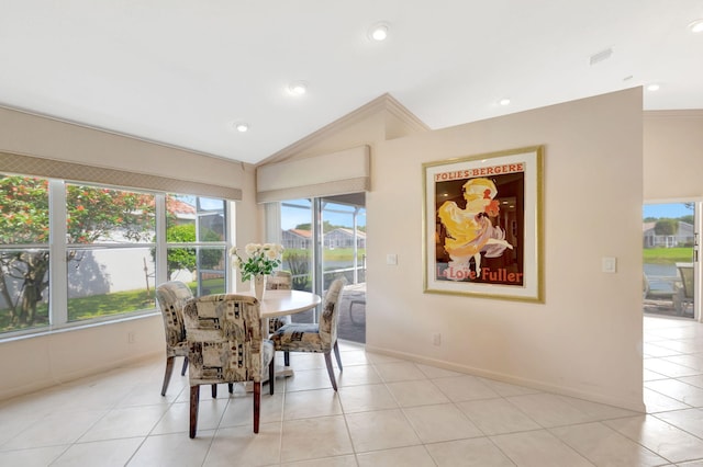 dining space with light tile patterned floors, vaulted ceiling, and recessed lighting