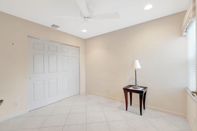 unfurnished bedroom featuring baseboards, visible vents, recessed lighting, and light tile patterned flooring