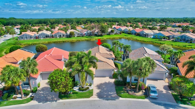 birds eye view of property featuring a residential view and a water view