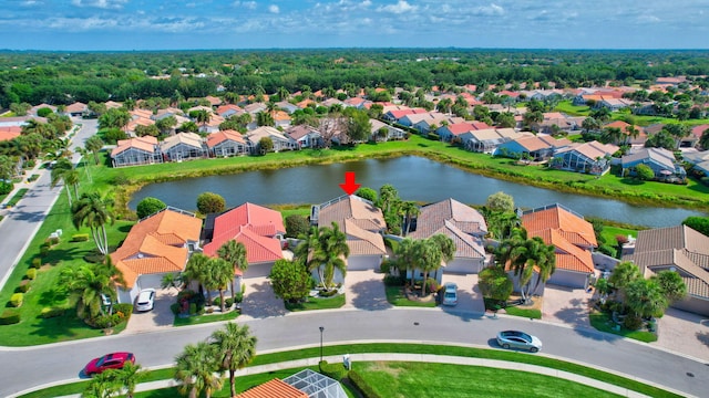aerial view featuring a water view and a residential view