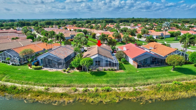 bird's eye view featuring a residential view and a water view