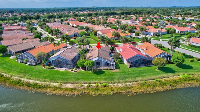 aerial view with a residential view and a water view