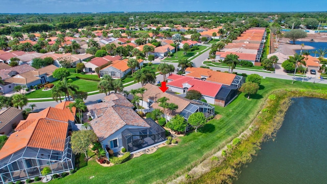 birds eye view of property featuring a residential view and a water view