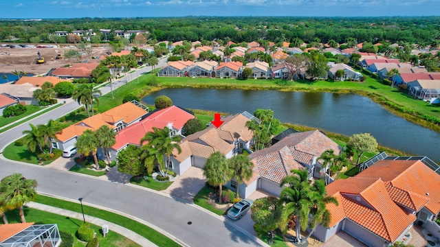 bird's eye view featuring a residential view and a water view