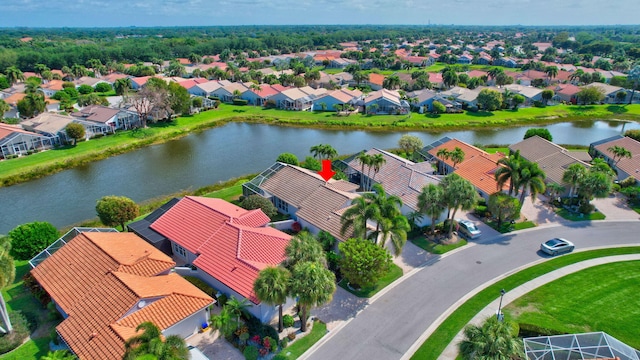 bird's eye view with a residential view and a water view