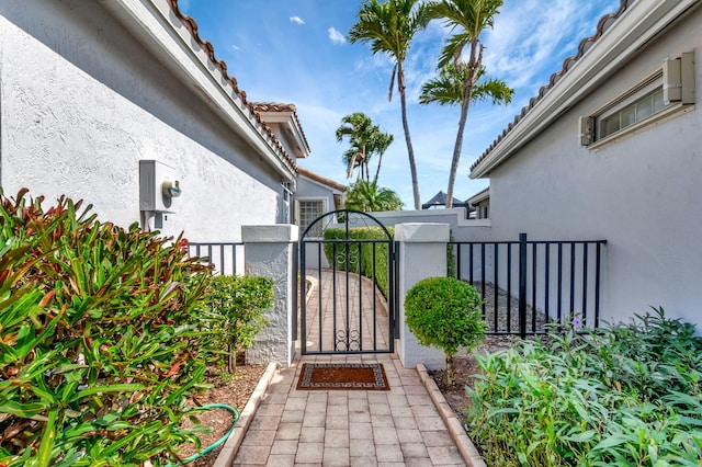 view of gate with fence