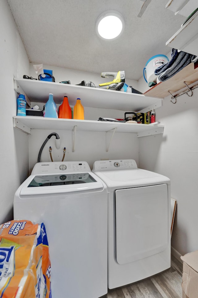 9441 W Mcnab Rd Unit 111, Tamarac, FL 33321 - laundry room with washing machine and clothes dryer and wood finished floors