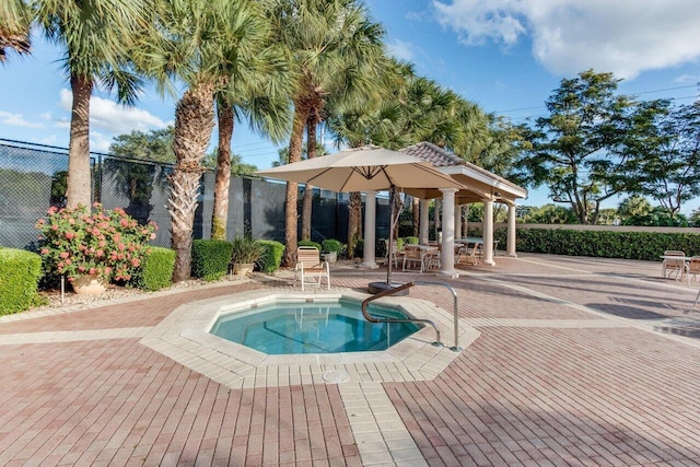 view of swimming pool with fence and a patio area