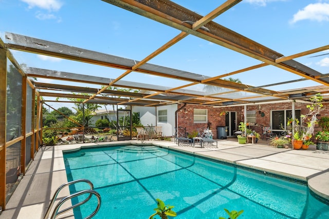1330 SW 27th Pl, Boynton Beach, FL 33426 - outdoor pool featuring a lanai and a patio area