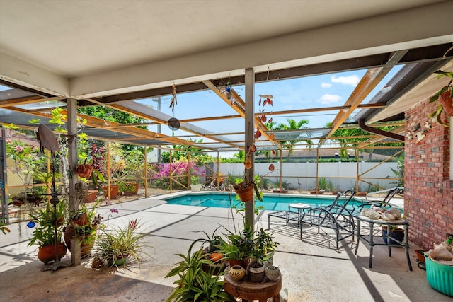 1330 SW 27th Pl, Boynton Beach, FL 33426 - view of pool featuring a fenced in pool, a fenced backyard, glass enclosure, and a patio area