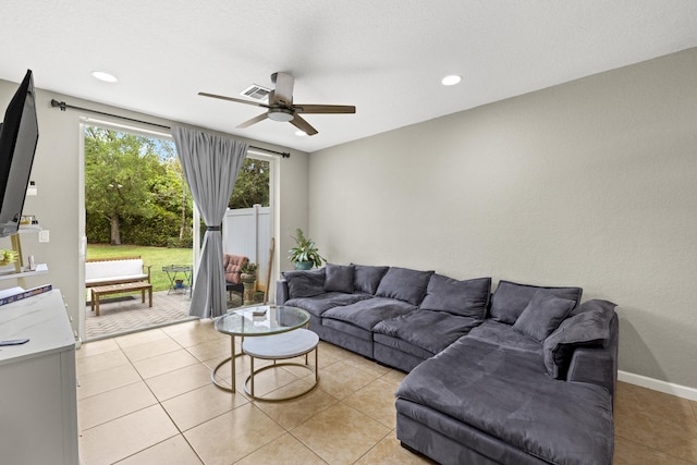 living room featuring ceiling fan, light tile patterned flooring, and recessed lighting