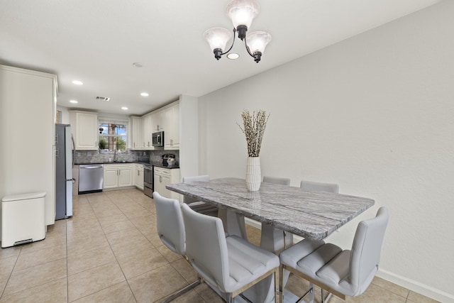 dining space with light tile patterned flooring, a chandelier, recessed lighting, and baseboards
