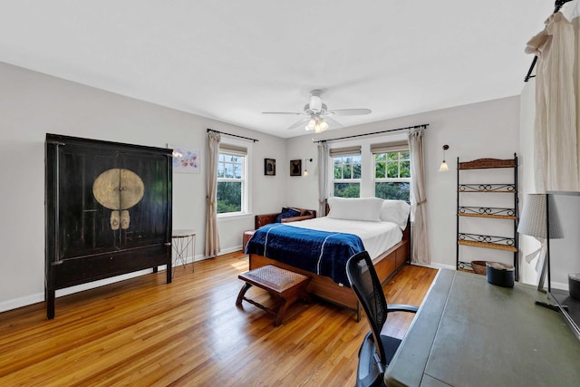 bedroom with baseboards and light wood-style floors