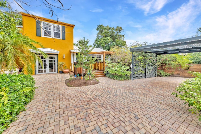 view of patio with a pergola and french doors