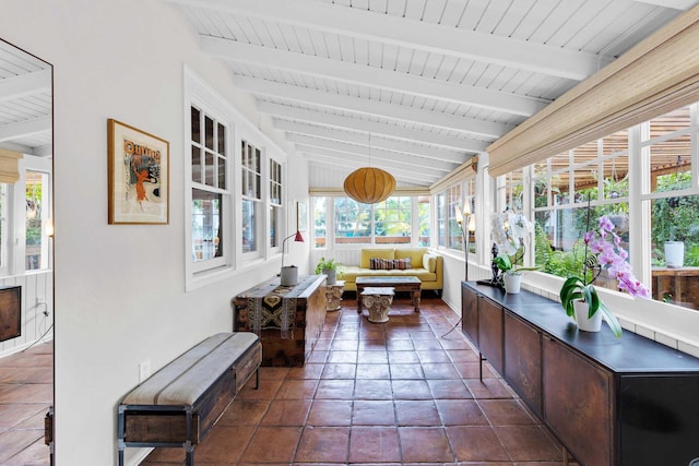 sunroom / solarium featuring wooden ceiling, vaulted ceiling with beams, and an outdoor hangout area