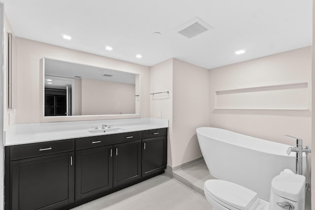 4001 N Ocean Blvd Unit 1602, Boca Raton, FL 33431 - full bathroom with a freestanding bath, vanity, toilet, baseboards, and tile patterned flooring