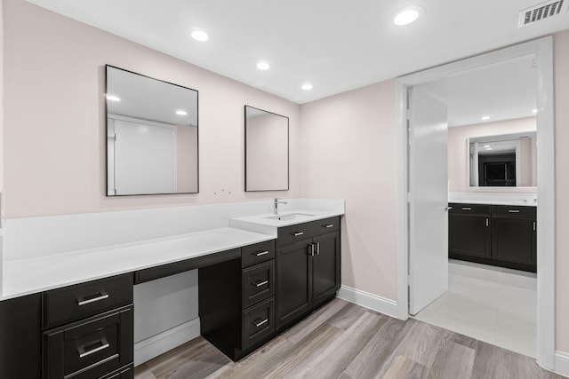 4001 N Ocean Blvd Unit 1602, Boca Raton, FL 33431 - bathroom featuring vanity, wood finished floors, baseboards, and recessed lighting