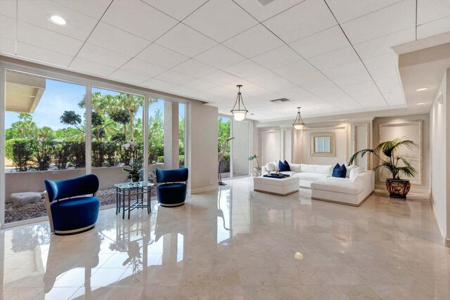 4001 N Ocean Blvd Unit 1602, Boca Raton, FL 33431 - living area with baseboards and marble tiled flooring