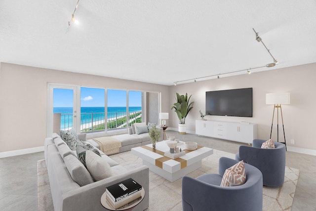 4001 N Ocean Blvd Unit 1602, Boca Raton, FL 33431 - living area with rail lighting and baseboards
