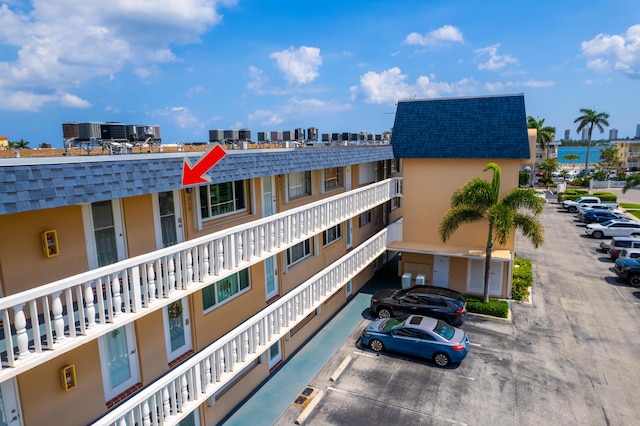 view of property featuring uncovered parking