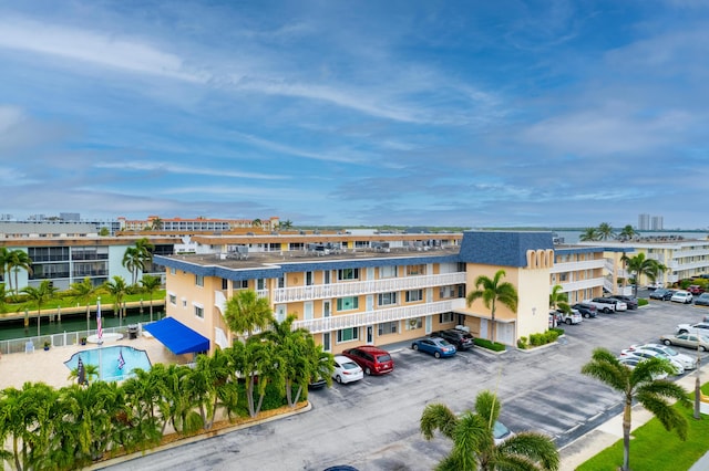 view of property featuring uncovered parking