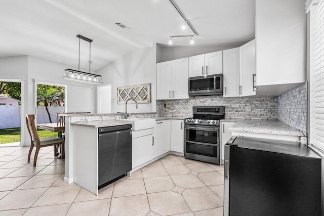 kitchen with white cabinetry, visible vents, a peninsula, and appliances with stainless steel finishes