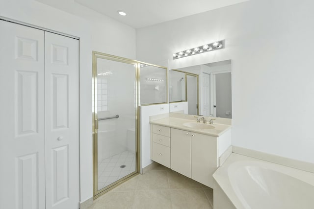 7130 Catania Dr, Boynton Beach, FL 33472 - bathroom featuring a stall shower, tile patterned floors, a closet, vanity, and a bath