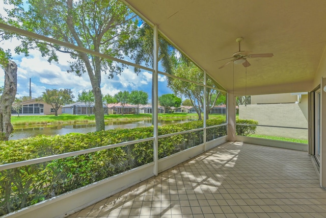 7130 Catania Dr, Boynton Beach, FL 33472 - unfurnished sunroom with a water view, a ceiling fan, and a residential view