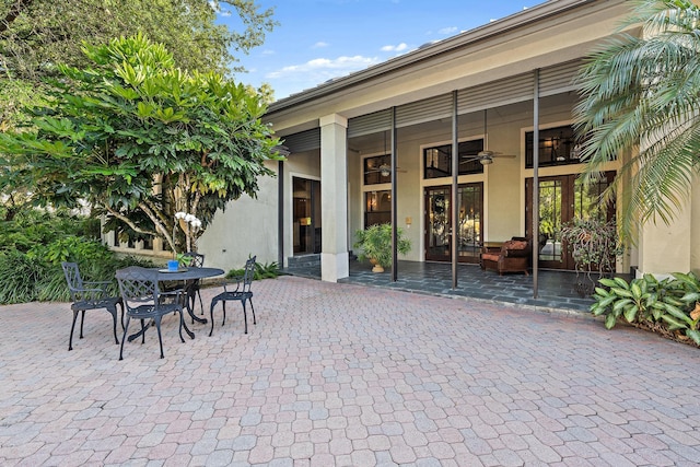 18907 SE Loxahatchee River Rd, Jupiter, FL 33458 - view of patio / terrace featuring a ceiling fan and outdoor dining area