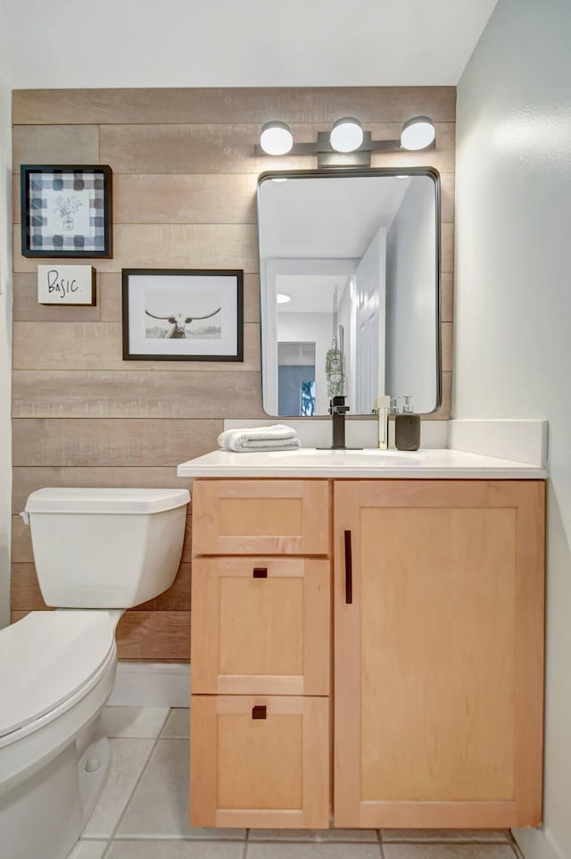 bathroom with tile patterned floors, toilet, and vanity