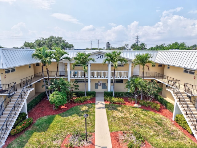 view of property featuring stairway