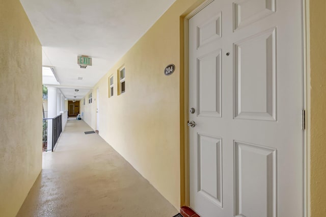 hall featuring concrete floors