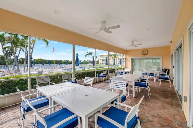 view of patio / terrace with a ceiling fan and outdoor dining area