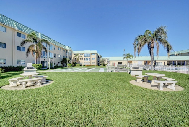 view of property's community featuring a yard