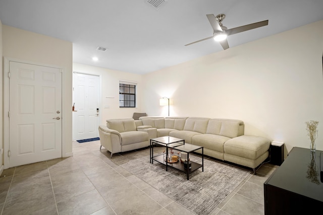 living area featuring visible vents, recessed lighting, light tile patterned floors, and a ceiling fan