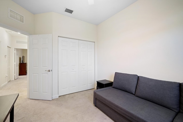 living area featuring baseboards, light colored carpet, and visible vents