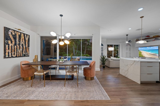15415 Alexander Run, Jupiter, FL 33478 - dining space featuring a chandelier, baseboards, wood finished floors, recessed lighting, and ceiling fan
