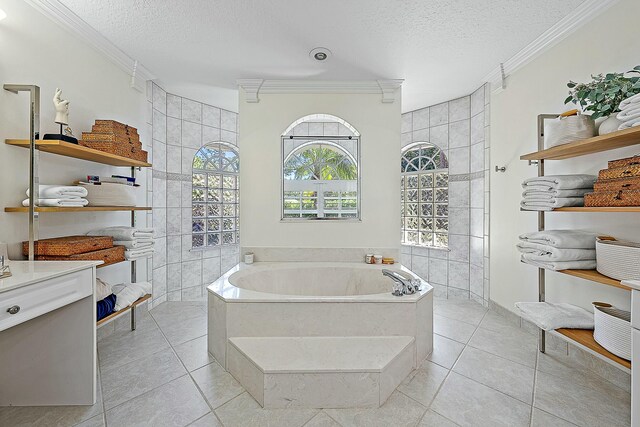 15415 Alexander Run, Jupiter, FL 33478 - full bath featuring ornamental molding, a bath, a textured ceiling, walk in shower, and tile patterned flooring