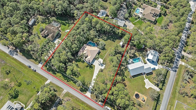 aerial view of property and surrounding area featuring property boundaries highlighted