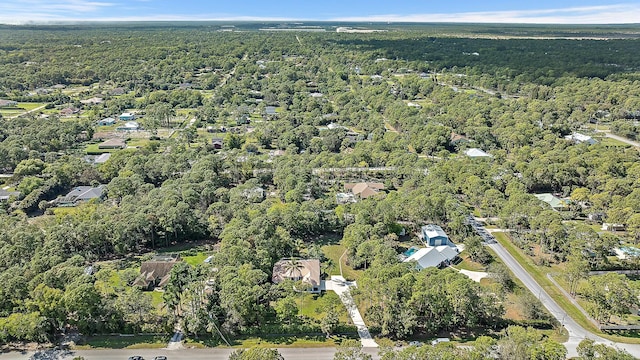aerial overview of property's location with a forest
