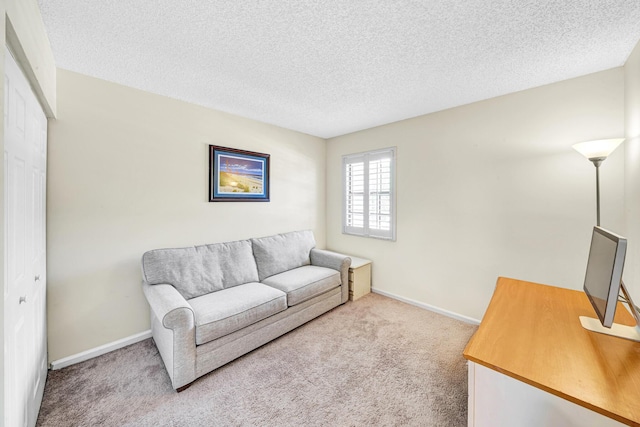 3050 Norwood Pl Unit N208, Boca Raton, FL 33431 - carpeted living area featuring a textured ceiling and baseboards