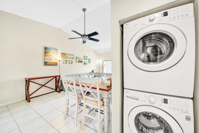 3050 Norwood Pl Unit N208, Boca Raton, FL 33431 - clothes washing area featuring laundry area, ceiling fan, light tile patterned flooring, stacked washing maching and dryer, and baseboards