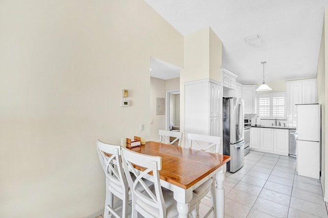 3050 Norwood Pl Unit N208, Boca Raton, FL 33431 - dining room featuring light tile patterned floors