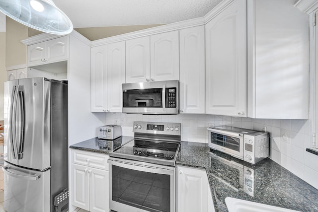 3050 Norwood Pl Unit N208, Boca Raton, FL 33431 - kitchen featuring dark stone countertops, white cabinetry, and stainless steel appliances